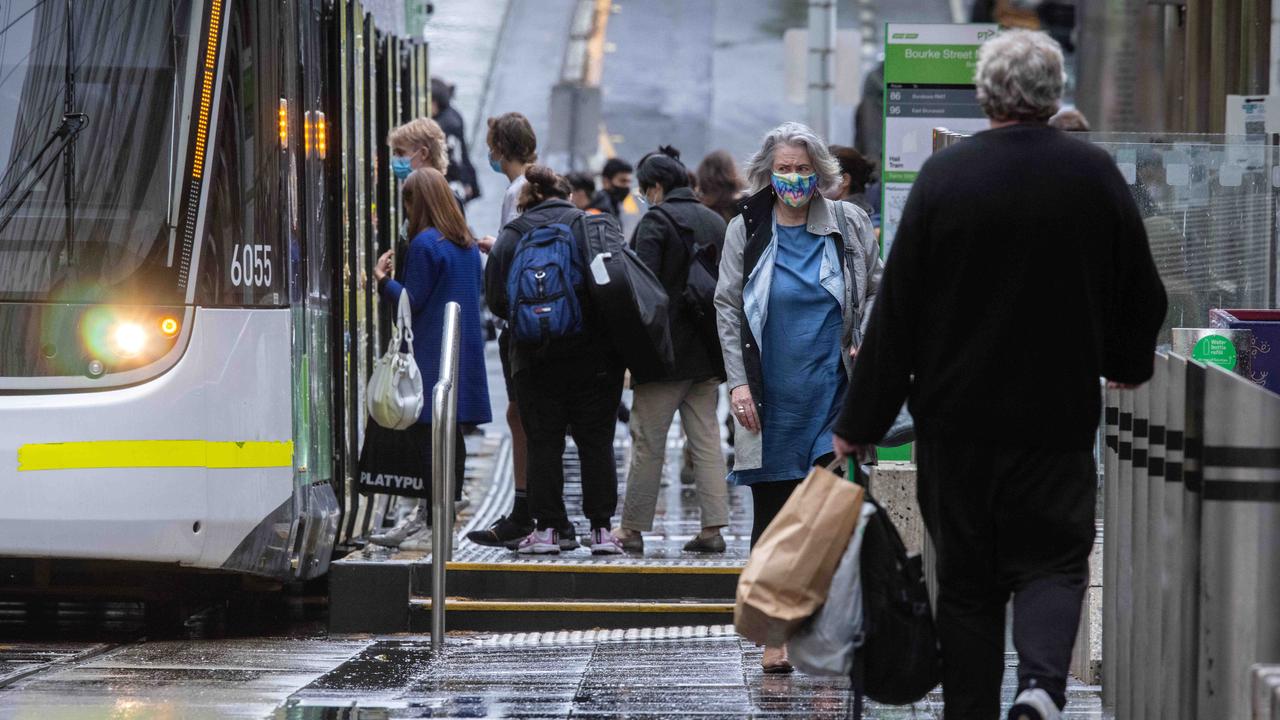 Victorian health authorities strongly recommend wearing masks in shared indoor settings if you can’t physically distance, and remind people they are required on public transport. Picture: NCA NewsWire/Sarah Matray