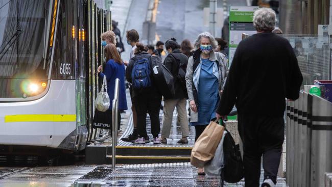 Victorian health authorities strongly recommend wearing masks in shared indoor settings if you can’t physically distance, and remind people they are required on public transport. Picture: NCA NewsWire/Sarah Matray