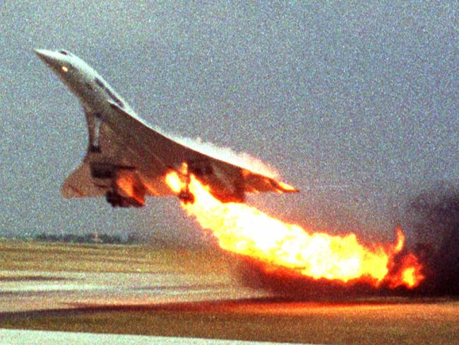 Air France Concorde flight 4590 takes off with fire trailing from its engine on the left wing from Charles de Gaulle Airport in Paris in 2000.