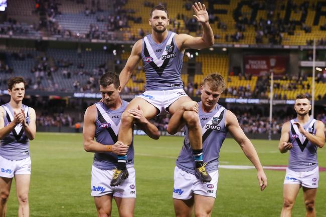 Port Adelaide players chair Travis Boak off Marvel Stadium after he played his 250th game in Round 7. Picture: Michael Klein.