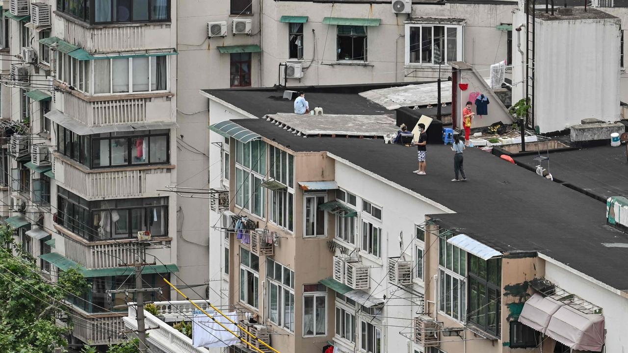 For millions of Shanghai residents, the only access to sunshine and fresh air has been found on apartment complex roofs as the city’s six-week lockdown continues. Picture: Hector RETAMAL/AFP