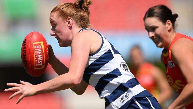 GOLD COAST, AUSTRALIA - SEPTEMBER 21: Aishling Moloney of the Cats runs with the ball during the round four AFLW match between Gold Coast Suns and Geelong Cats at People First Stadium, on September 21, 2024, in Gold Coast, Australia. (Photo by Matt Roberts/Getty Images)