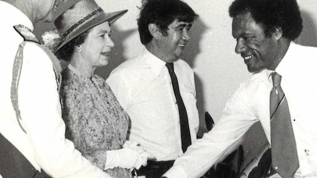 Sir John Yocklunn, third from left, introduces Mr Gobu Mail Liaison Officer to HRH Queen Elizabeth and the Duke of Edinburgh during the 1982 royal visit.