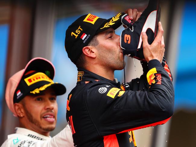 MONTE-CARLO, MONACO - MAY 27: Race winner Daniel Ricciardo of Australia and Red Bull Racing celebrates on the podium with a shoey during the Monaco Formula One Grand Prix at Circuit de Monaco on May 27, 2018 in Monte-Carlo, Monaco.  (Photo by Dan Istitene/Getty Images)