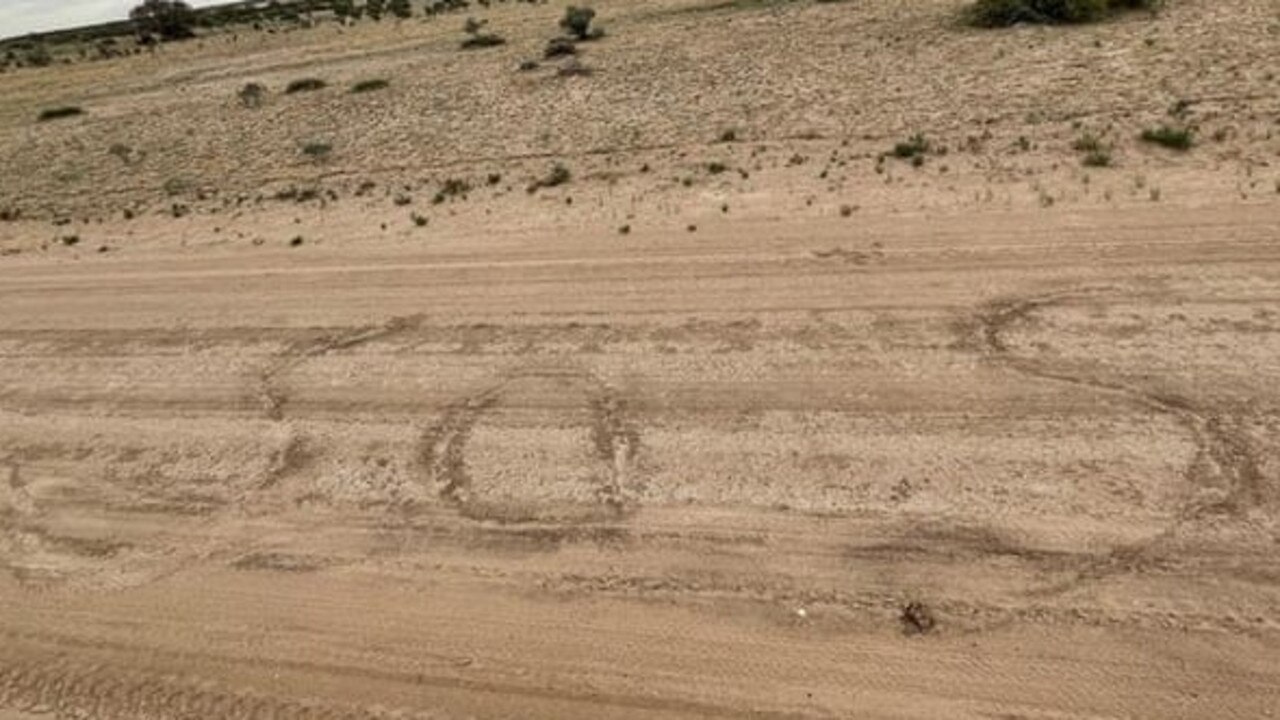 They wrote messages in the sand while attempting to walk to a remote town. Picture: RFDS