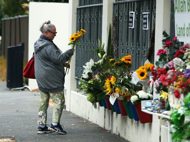 Flowers were laid outside the Christchurch mosque one year on from the massacre which killed 51 people. Picture: Aaron Francis