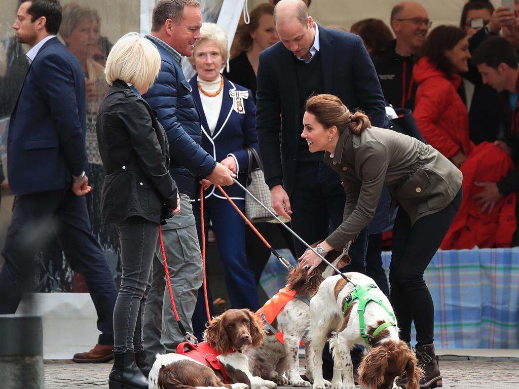 Prince William and Kate greeted therapy dog, Max, who they first met with mental health campaigner and owner Kerry Irving at Buckingham Palace last month. Picture: Peter Byrne/PA Wire