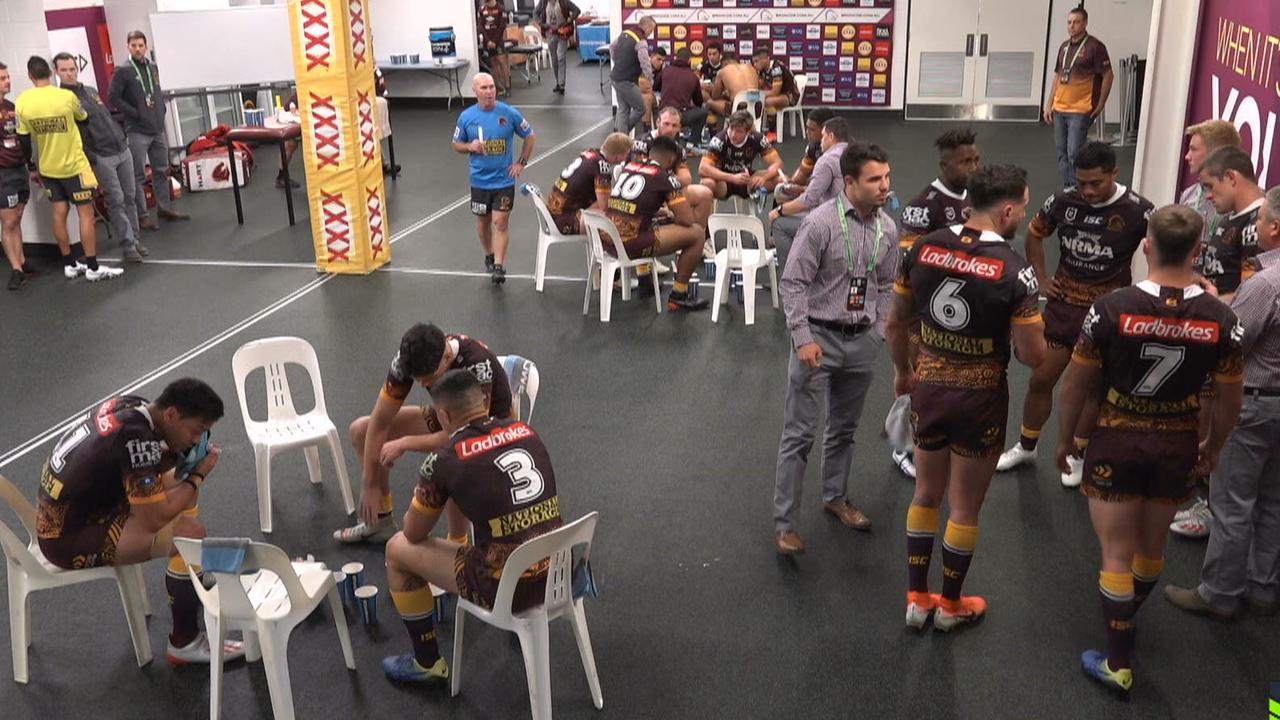 Broncos players were broken up into smaller groups for the halftime talk at Suncorp Stadium.