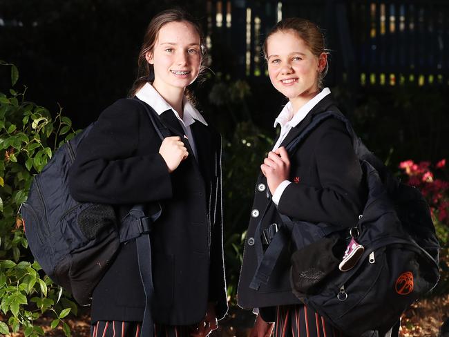 Keala Hayes 14 in grade 8 and Estella Manson 13 in grade 7.  who are good friends who both attend Fahan School in Hobart.  It will be the first day back for many secondary school students after COVID-19 restrictions forced learning to be done remotely.  Picture: NIKKI DAVIS-JONES