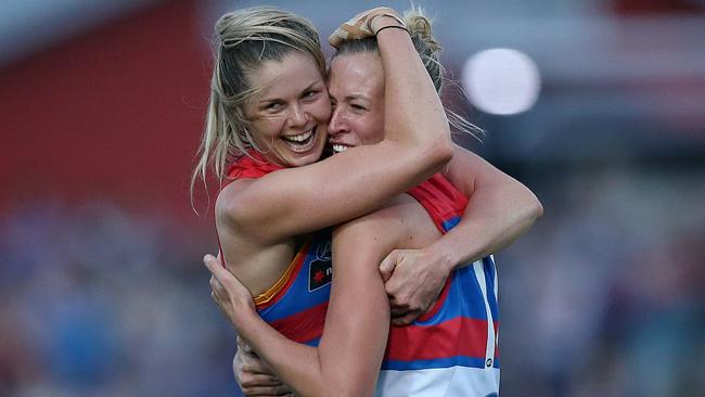 Katie Brennan celebrates the Bulldogs’ Round 1 win with teammate Lauren Spark. Picture: Wayne Ludbey