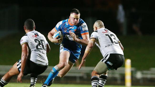 Will Bugden storms towards the Souths Logan defensive line. Picture: Brendan Radke