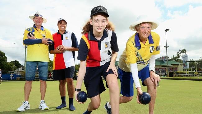 Student Asheligh Keeffe, (middle) bowls club member Carol Cosgrove (right) Kevin Burdon (left) and student Jacob Carter at Jindalee Bowls Club. Centenary State High health and recreation students learned bowls at the club this year. Picture: AAP/Jono Searle