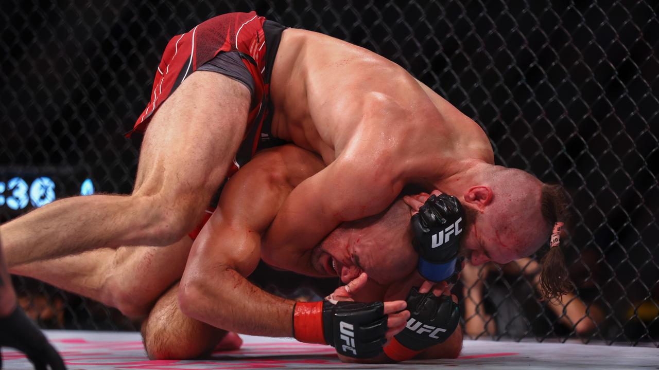 Jiri Prochazka from the Czech Republic submits Glover Teixeira from Brazil.  (Photo by Yong Teck Lim/Getty Images)