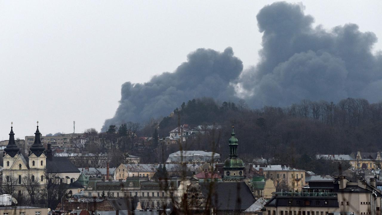 Dark smoke rises from a fire following an air strike in the western Ukrainian city of Lviv, on March 26, 2022. Picture: Yuriy Dyachyshyn / AFP.