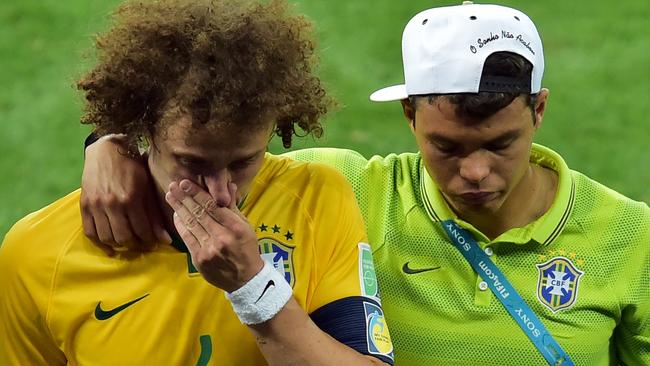 David Luiz is consoled by Brazil captain Thiago Silva.