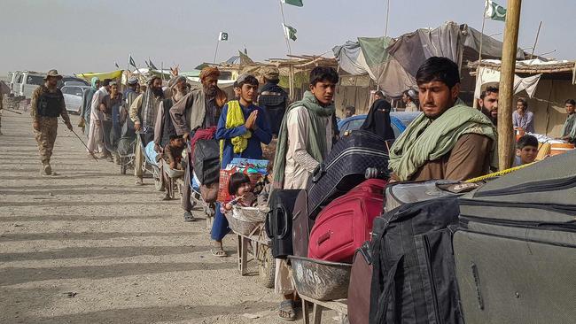 Afghan nationals queue up at the Pakistan-Afghanistan border crossing point in Chaman on August 17. Picture: AFP