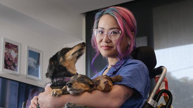 Disability advocate Akii Ngo with their dogs Jojo, Ponyo and Arri. Picture: Valeriu Campan