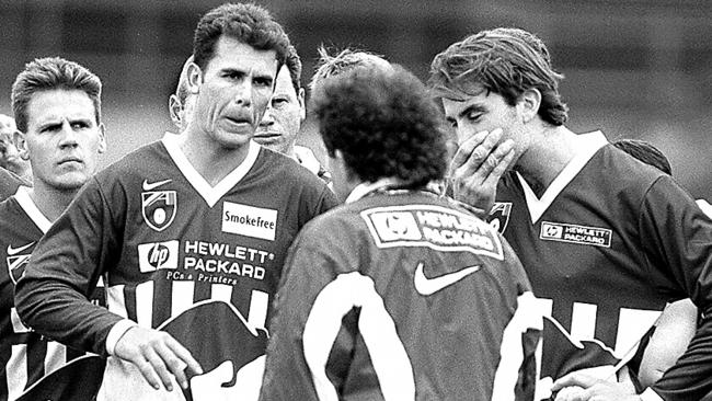 Coach Denis Pagan talking with Wayne Carey and McKernan.