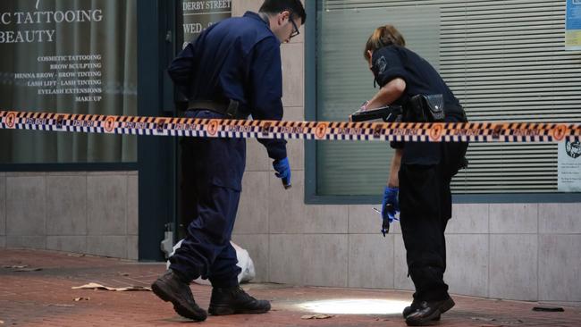 Police and forensics investigate the incident. Picture: Damian Hoffman