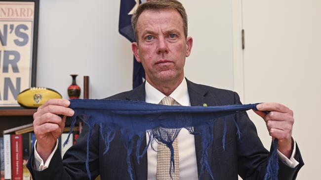 CANBERRA, Australia - NewsWire Photos - September 9, 2024: Federal Member for Wannon, Dan Tehan holds part of the flag that flys above Parliament House in Canberra. Picture: NewsWire / Martin Ollman