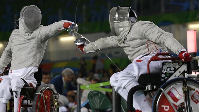 Polish fencer Adrian Castro (right) competes with China’s Yanke Feng at the Paralympic Games in Rio.