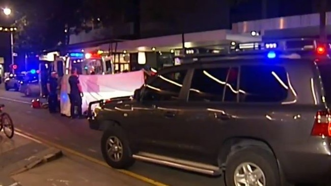 Paramedics work to save the life of a teenager stabbed in the chest during a brawl in a Brisbane CBD hotel. Picture: 9 News