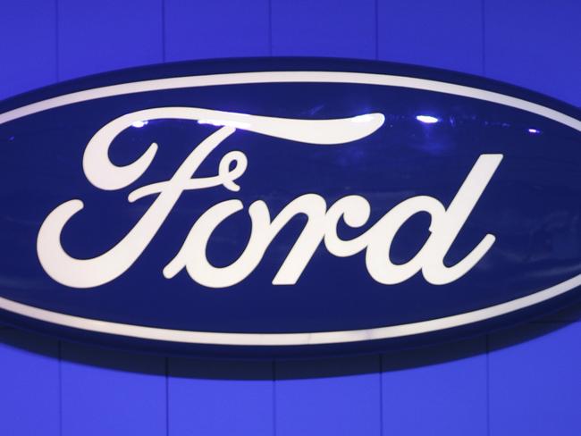 The Ford logo on display at the company's booth at the North American International Auto Show in Detroit, Michigan on January 10, 2011. AFP PHOTO/Geoff Robins