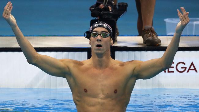 Michael Phelps celebrates after winning the 200m butterfly in Rio.