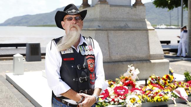 Navy veteran David "Robbo" Roberts paused for one minute's silence at the Cairns cenotaph during the Cairns RSL's Remembrance Day service on the Cairns Esplanade. Picture: Brendan Radke