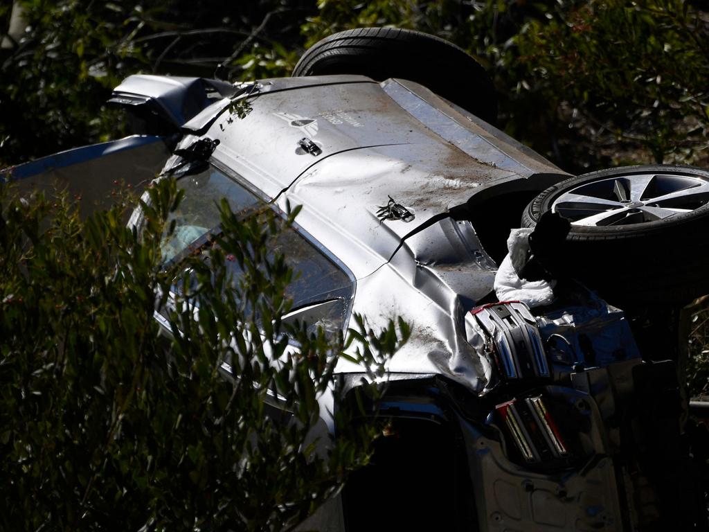 The vehicle driven by golfer Tiger Woods lies on its side in Rancho Palos Verdes, California.