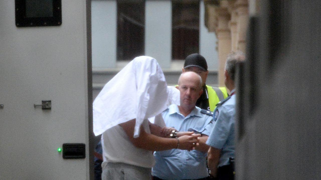 Xiaozheng Lin covered his face as he was brought into court. Picture: NewsWire / Andrew Henshaw