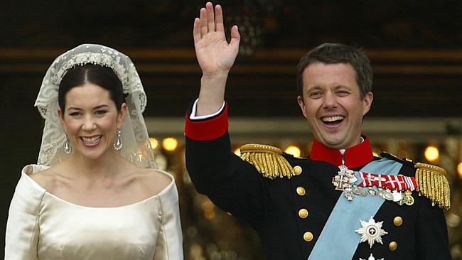 All laughs...Crown Prince Frederik and bride Crown Princess Mary of Denmark waved to wellwishers after their wedding ceremony in 2004. Picture: Supplied.