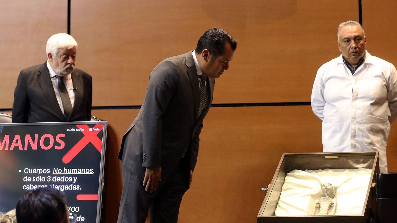 Congressman Sergio Gutierrez looking at the alleged ET body. Picture: Handout/AFP