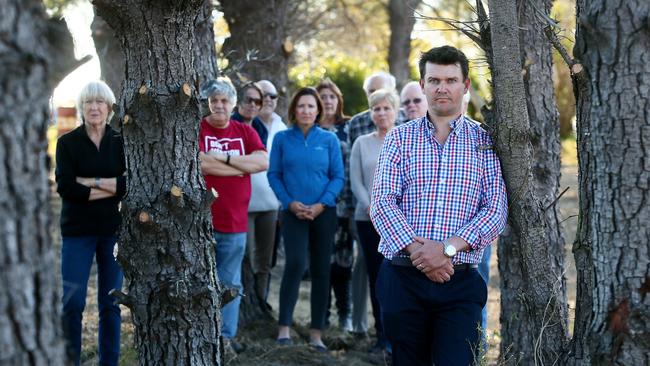 Ben Seale with Dural residents campaigning against a proposal for seniors housing at 3 Quarry Rd and 4 Vineys Rd, Dural. Picture: Sue Graham