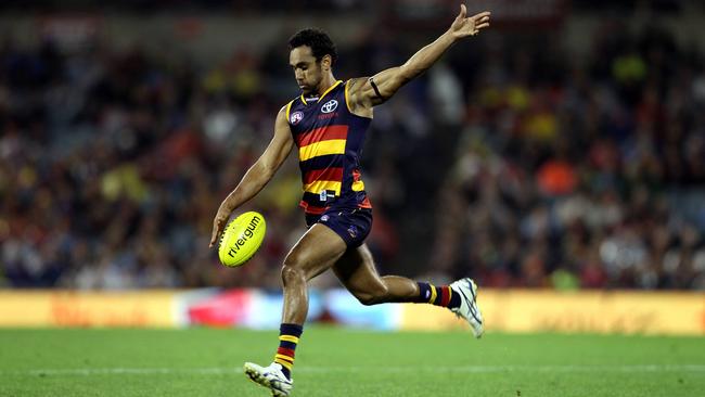 Richard Tambling in full flight for the Crows at Football Park.