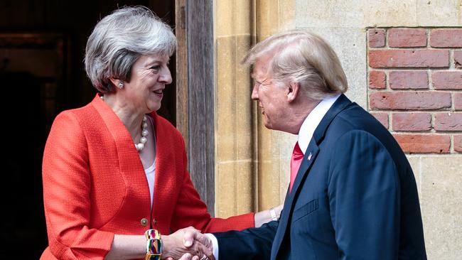 Donald Trump and Theresa May greet each other at Chequers. Picture: Getty Images