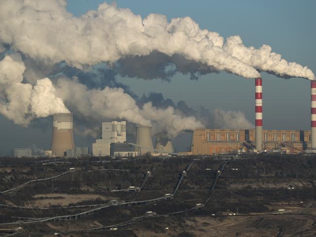 ROGOWIEC, POLAND - NOVEMBER 29: Steam and smoke rise from the Belchatow Power Station as the open-pit coal mine that feeds the station coal lies below on November 29, 2018 in Rogowiec, Poland. The Belchatow station, with an output of 5,472 megawatts, is the world's largest lignite coal-fired power station. The station emits approximately 30 million tonnes of CO2 per year. The United Nations COP 24 climate conference is due to begin on December 2 in nearby Katowice, two hours south of Belchatow.  (Photo by Sean Gallup/Getty Images)