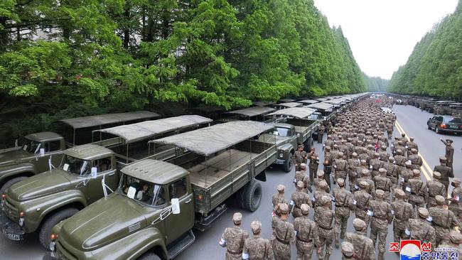 State-released image of military medical field officers of the Korean People's Army going to supply medicines in response to the country’s Covid-19 outbreak. Picture: Supplied