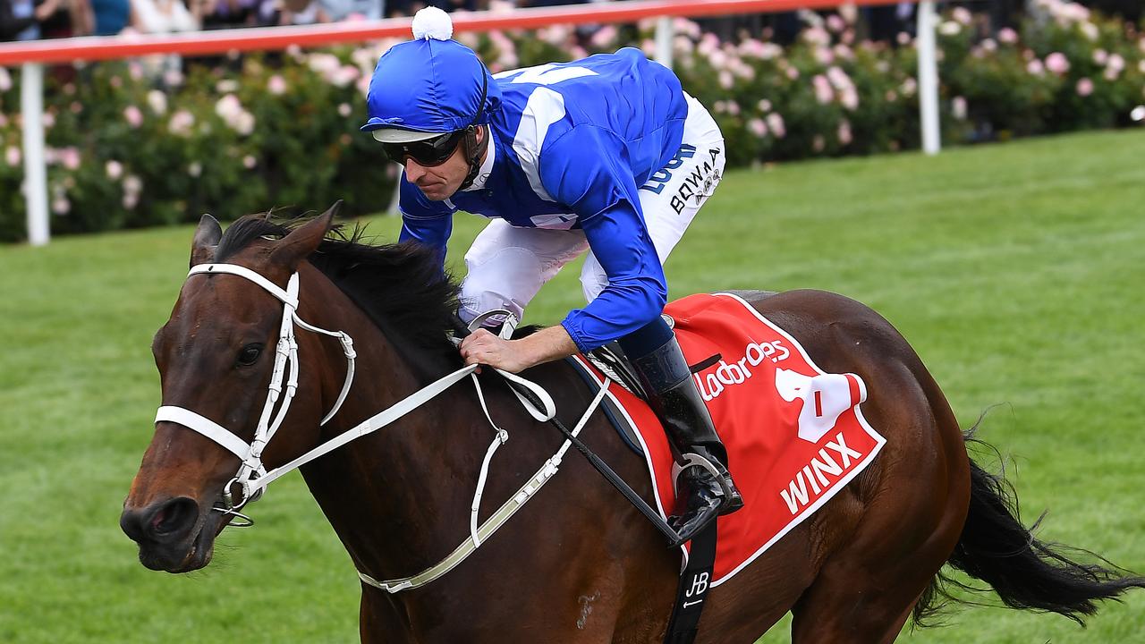 Jockey Hugh Bowman rides Winx to victory in the Cox Plate.