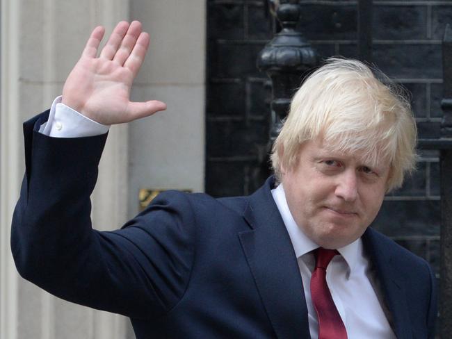 (FILES) In this file photo taken on July 13, 2016 Newly appointed Foreign Secretary Boris Johnson waves as he leaves 10 Downing Street in central Londonafter new British Prime Minister Theresa May took office.  British Foreign Secretary Boris Johnson has resigned, Downing Street said in a statement on July 9, 2018, hours after Brexit minister David Davis stepped down. / AFP PHOTO / OLI SCARFF