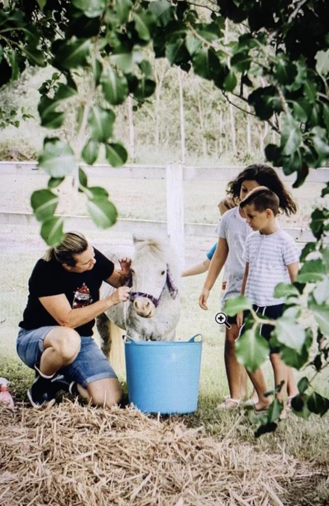 The Henry family with their miniature pony Sunny. The pony was mauled to death by dogs at Logan. Picture: Supplied.