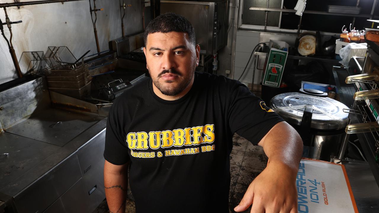 Owner of Grubbies Ben Niumata in his burnt and damaged Strathpine store. Picture: Liam Kidston