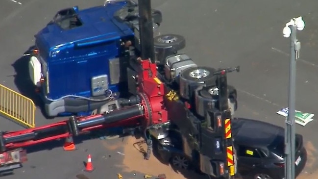 A crane fell and crushed parked cars at Bond University. Picture: 9News Queensland.