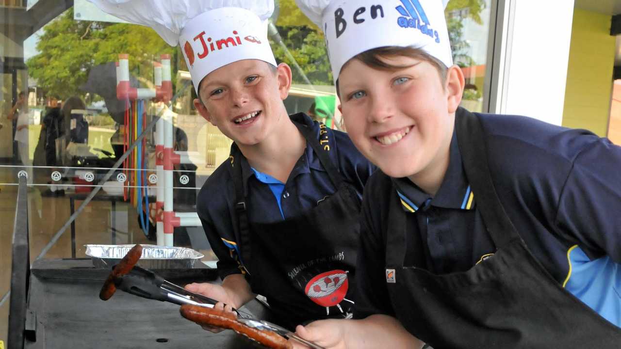 James Duggan and Ben Duffey cook up a storm on the barbecue. Picture: Frances Klein