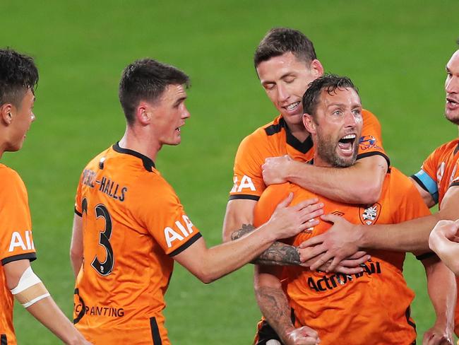 SYDNEY, AUSTRALIA - JULY 29: Scott McDonald of the Roar celebrates with team mates after scoring a goal during the round 24 A-League match between the Melbourne Victory and the Brisbane Roar at Bankwest Stadium on July 29, 2020 in Sydney, Australia. (Photo by Matt King/Getty Images)