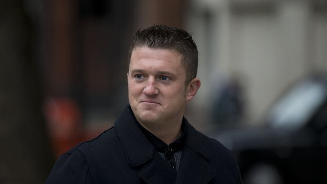 FILE - In this Wednesday, Oct. 16, 2013 file photo, Tommy Robinson the former leader of the far-right EDL "English Defence League" group arrives for an appearance at Westminster Magistrates Court in London. Robinson, a prominent far-right activist in Britain, has been jailed for 13 months on Tuesday, May 29, 2018 after live-streaming outside a criminal trial in violation of reporting restrictions. Robinson, a pseudonym of 35-year-old Stephen Yaxley-Lennon, was arrested last week at Leeds Crown Court in northern England. (AP Photo/Matt Dunham, File)