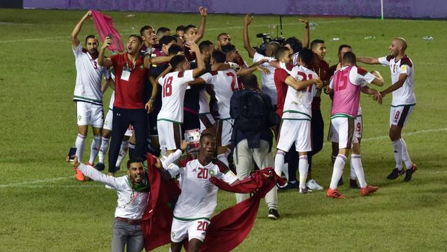 Morocco's players celebrate qualifying for the World Cup.