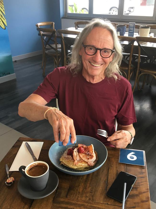 Content Jabiru customer Brian Watson tucks into breakfast at the new cafe which only opened last week at Nundah Village. Picture: Darren Cartwright