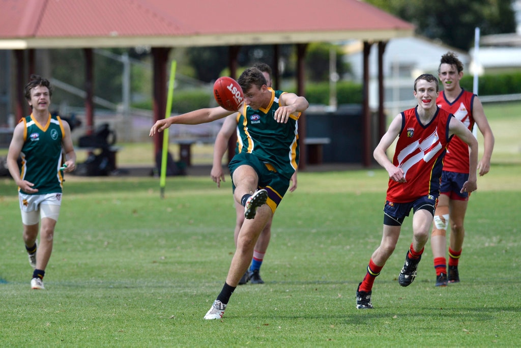 Jackson Tuckey of Centenary Heights State High School kicks out against Concordia in AFL Queensland Schools Cup Darling Downs round at Captain Cook ovals, Friday, April 27, 2018. Picture: Kevin Farmer