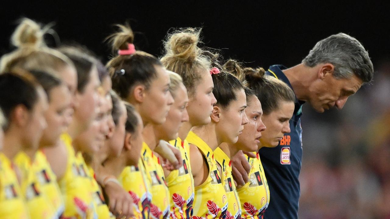 Crows players stand together during a minute’s silence as a mark of respect to the passing of former teammate Heather Anderson. Picture: Matt Roberts/Getty Images